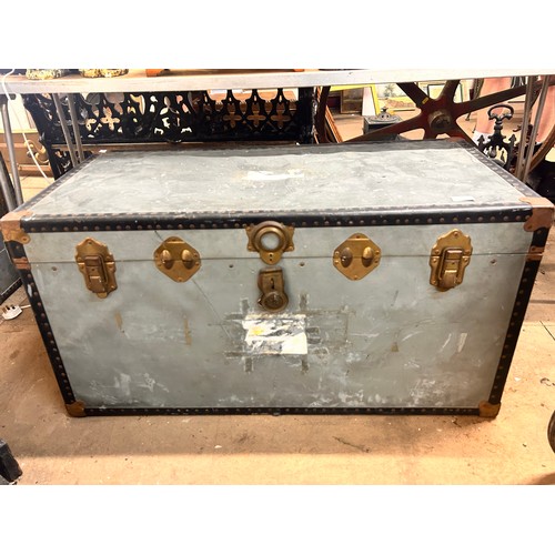 301 - An early 20th Century steamer trunk and an enamlled bread bin