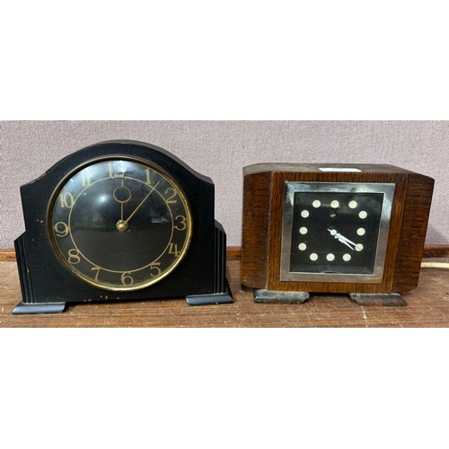 324 - An early 20th Century oak mantle clock and an ebonised mantle clock