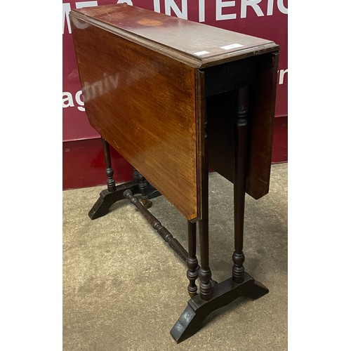 131 - An Edward VII inlaid mahogany Sutherland table