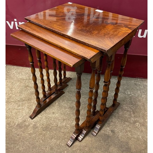 133 - An Edward VII mahogany bobbin turned nest of tables