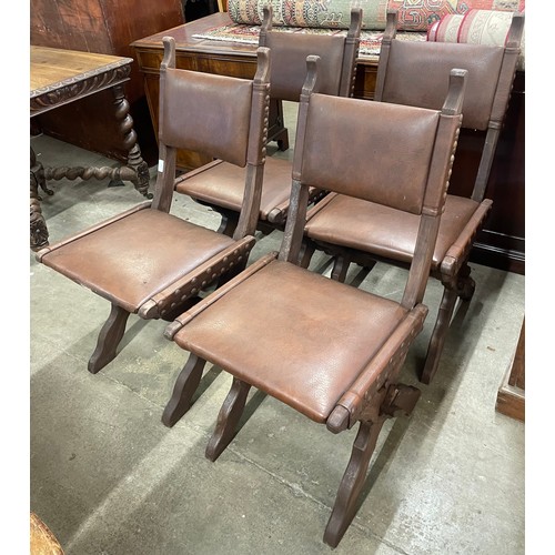 147 - A set of four Arts and Crafts oak X-frame dining chairs