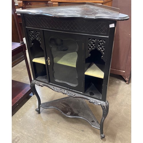 150 - A Victorian ebonised corner display cabinet