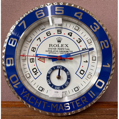 336 - A Rolex dealers display wall clock