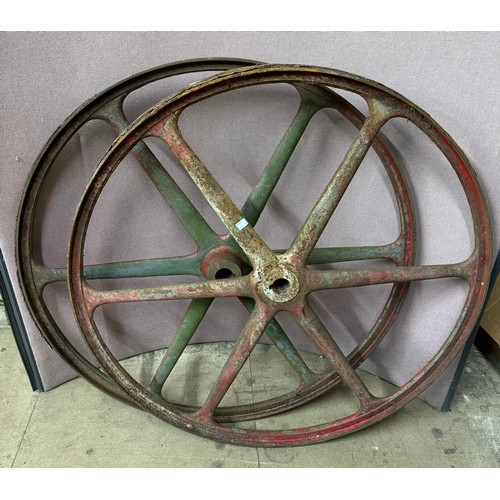 307 - A pair of cast iron cart wheels