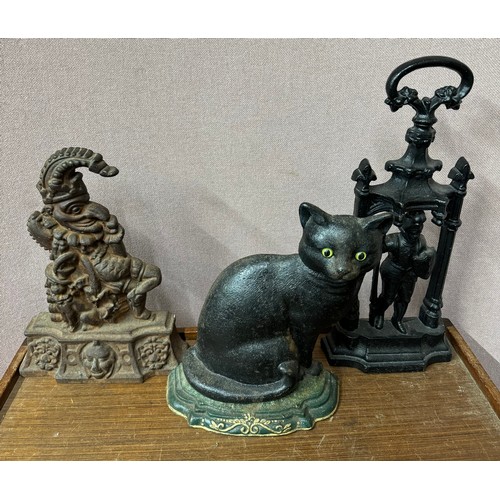 308 - Three assorted early 20th Century cast iron doorstops