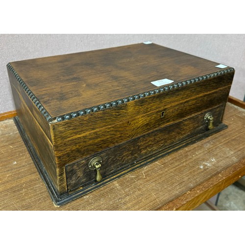 312 - An early 20th Century carved oak canteen