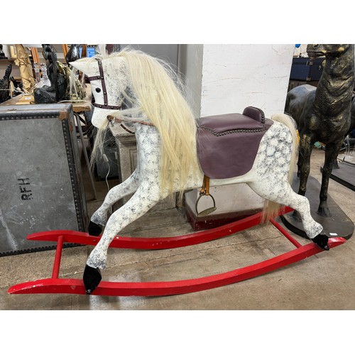 317 - An early 20th Century French painted rocking horse