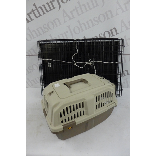 5277 - A pet carrier and a dog cage