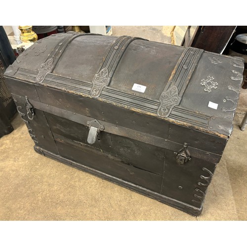 275 - A Victorian metal bound domed top steamer trunk