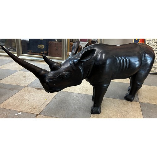 285 - A large carved hardwood figure of a rhinoceros