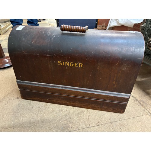 288 - A cased Singer sewing machine (locked and without key)