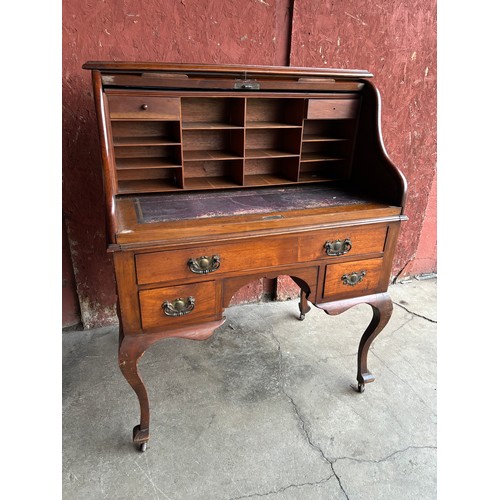 168A - A Victorian walnut tambour roll top desk