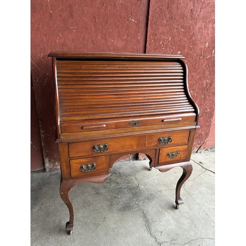 168A - A Victorian walnut tambour roll top desk