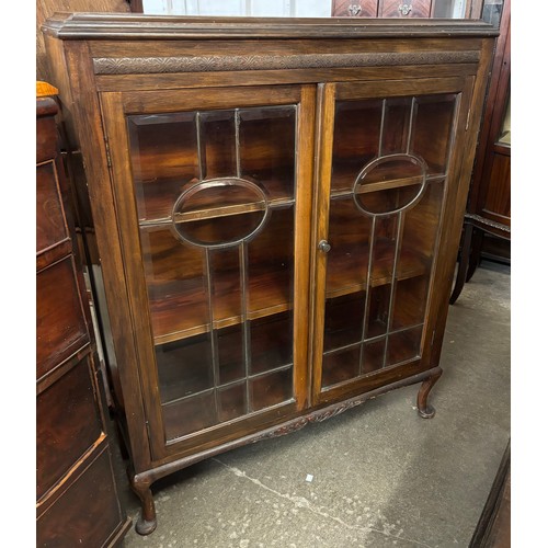 126 - An Edward VII carved mahogany display cabinet