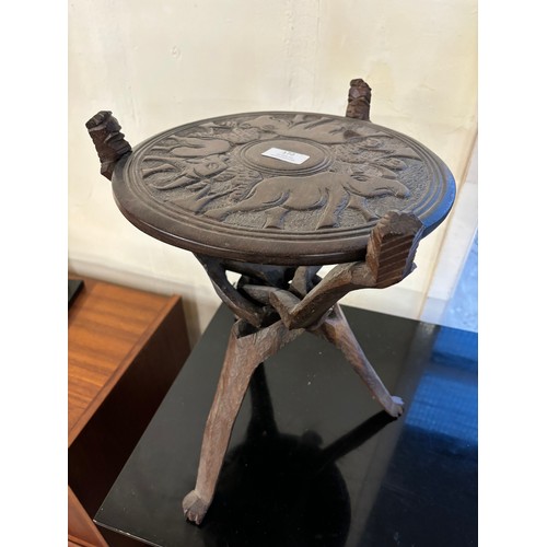 172 - A small African carved hardwood occasional table