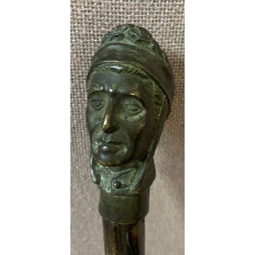 349A - A bronze handled walking cane depicting Dante