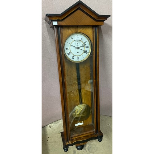 350 - A 19th Century walnut Vienna wall clock