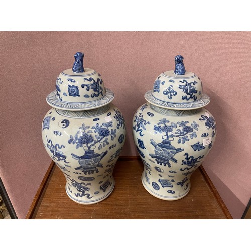 364 - A pair of Chinese blue and white porcelain vases and covers