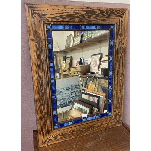 375 - An oak framed stained glass mirror