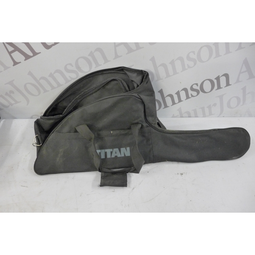 5172 - A Titan TTL759CHN petrol chainsaw with storage bag and a set of ratchet straps