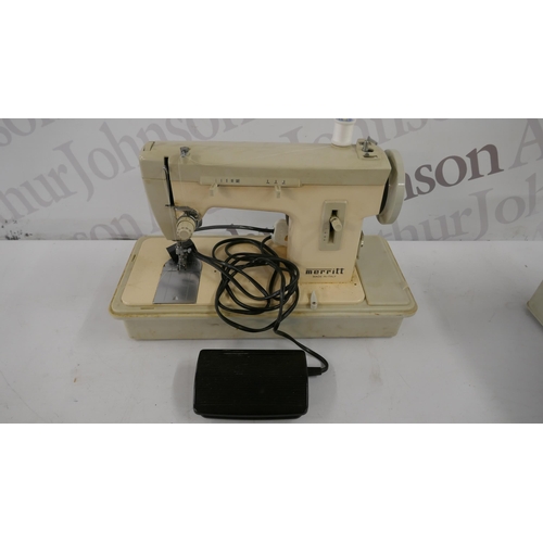 5298 - A Merit electric sewing machine with pedal and an assortment of threads