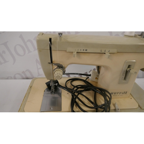 5298 - A Merit electric sewing machine with pedal and an assortment of threads