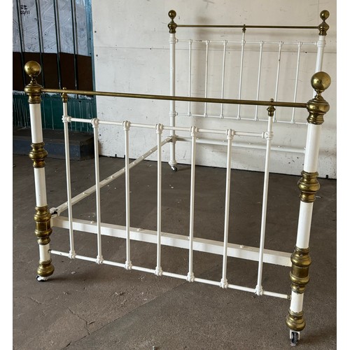 272 - A Victorian painted cast iron and brass bed