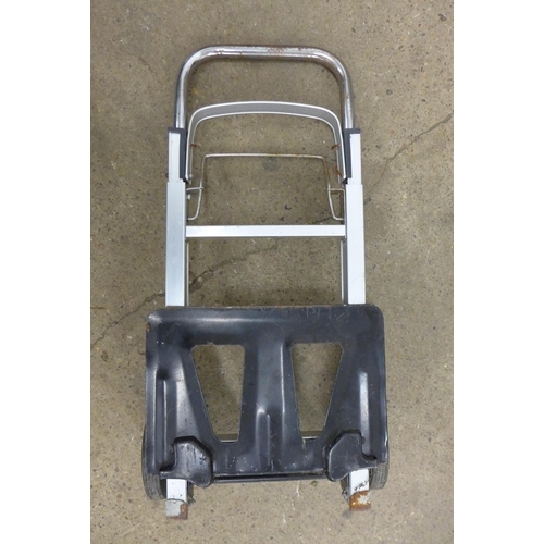 5195 - A Black and Decker Workmate and one other, a quantity of plastic drain rods and a sack trolley