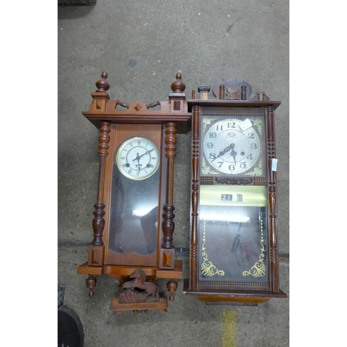 5314 - Two timber cased pendulum wall clocks