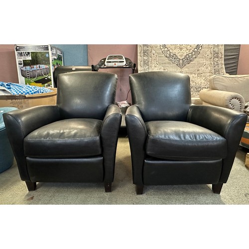 3184 - A pair of black Carezza Phoenix leather effect armchairs