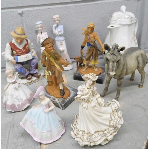 1037 - A collections of figures including fine ladies, two pirates, old gentleman on accordion and a donkey... 