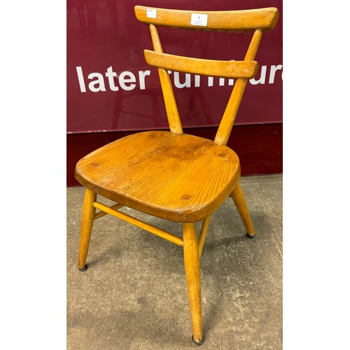 9 - An Ercol Blonde elm and beech child's yellow dot chair