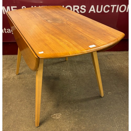 10 - An Ercol Blonde elm and beech Windsor drop-leaf table