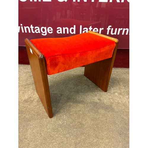 19 - A teak and orange fabric footstool