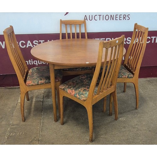 32 - A Danish teak circular dining table and four chairs