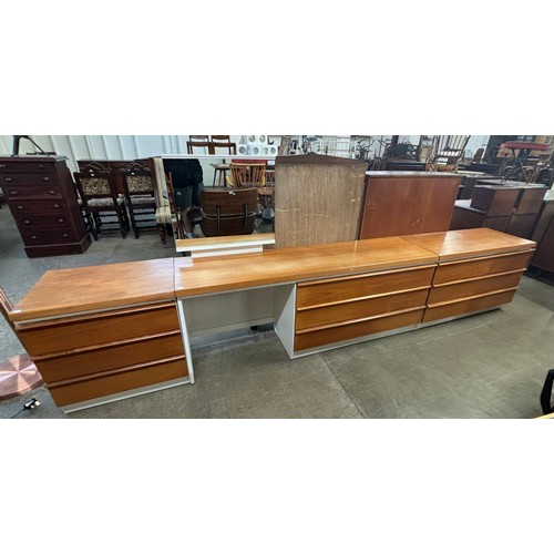 38 - A teak and white laminate dressing chest and two chests of drawers