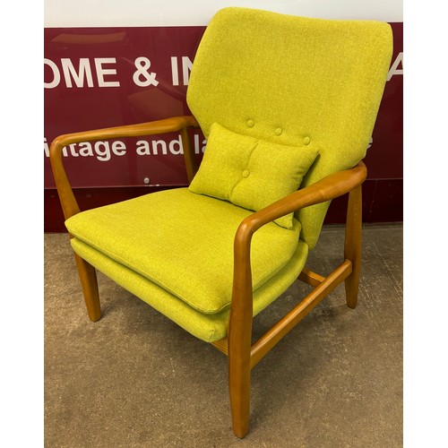 43 - A Danish style teak and lime green fabric upholstered armchair