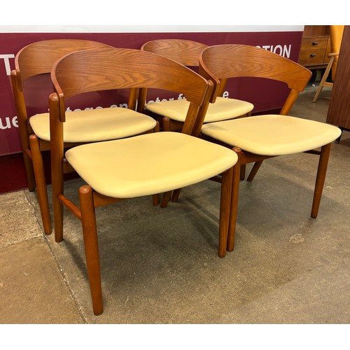 45 - A set of four Danish style ash and cream vinyl dining chairs