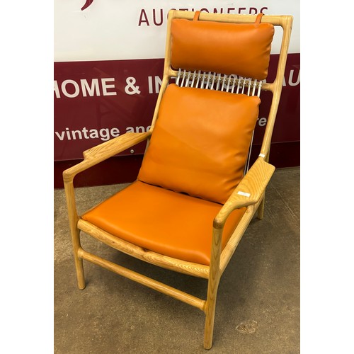 46 - A Danish style ash and tan vinyl armchair