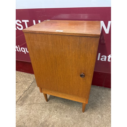 59 - A teak bedside cabinet