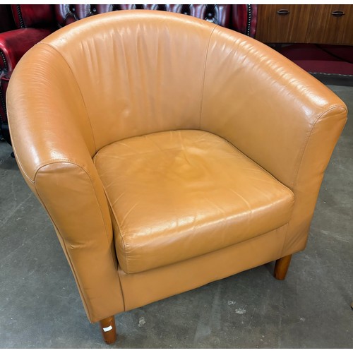 63 - A tan leather tub chair