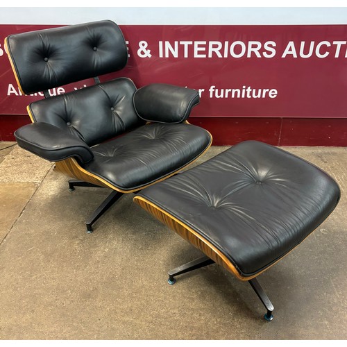 1 - A Charles and Ray Eames style simulated rosewood and black leather revolving lounge chair and ottoma... 