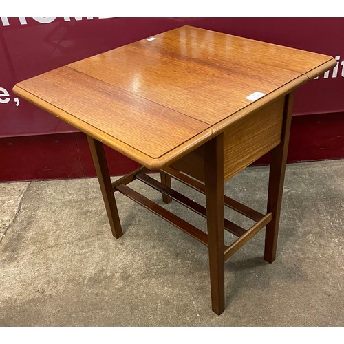 31 - A small teak drop-leaf occasional table