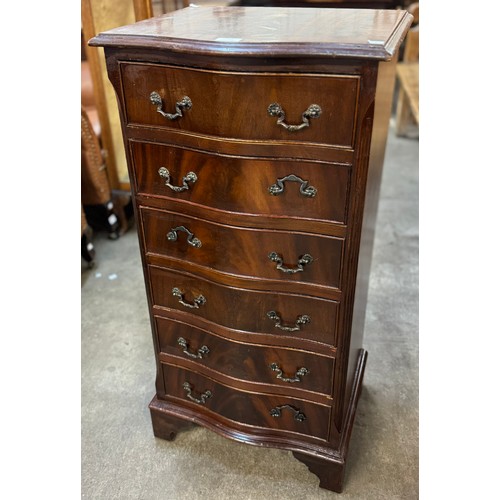 129 - A mahogany serpentine chest of drawers