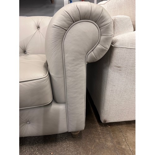 3055 - A stone leather Chesterfield love seat