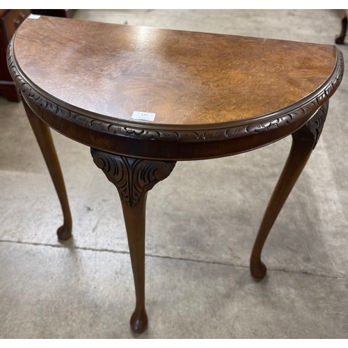 137 - A Queen Anne style burr walnut demi-lune hall table