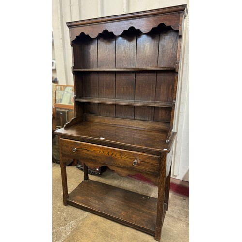 147 - An early 20th Century carved oak dresser