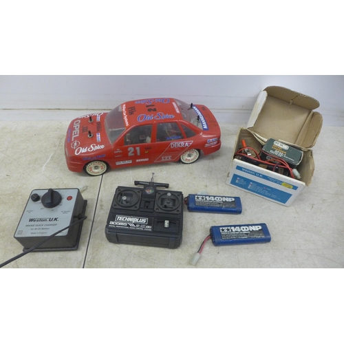 5055 - A remote control Opel Calibra Old Spice team Rosberg rally car with remote, battery and charger etc.