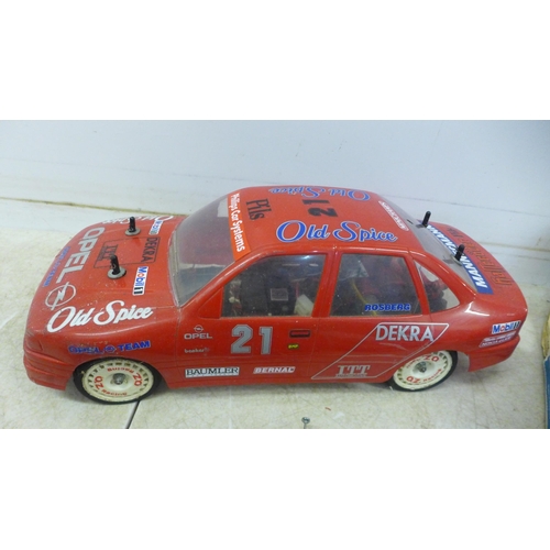 5055 - A remote control Opel Calibra Old Spice team Rosberg rally car with remote, battery and charger etc.