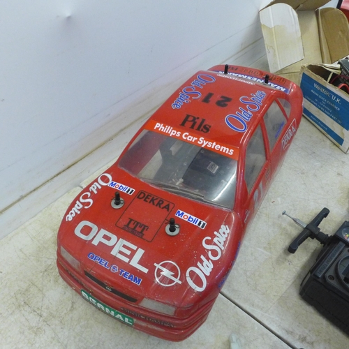 5055 - A remote control Opel Calibra Old Spice team Rosberg rally car with remote, battery and charger etc.